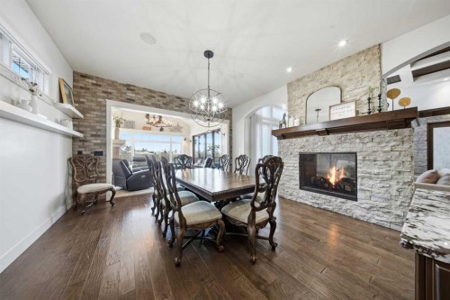 24 Sagewood Close, Red Deer, AB - Indoor Photo Showing Dining Room With Fireplace