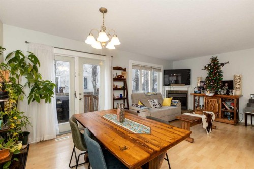 5032 47 Street, Sylvan Lake, AB - Indoor Photo Showing Other Room With Fireplace