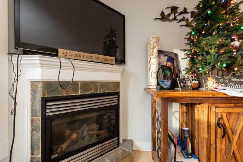5032 47 Street, Sylvan Lake, AB - Indoor Photo Showing Living Room With Fireplace