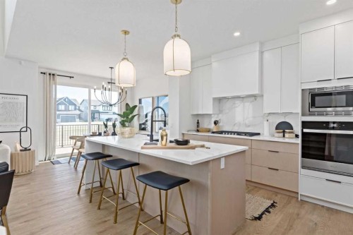1010 Fowler Road Sw, Airdrie, AB - Indoor Photo Showing Kitchen With Upgraded Kitchen