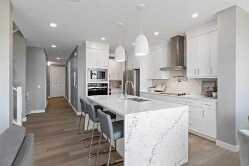 207 Huxland Path, Calgary, AB - Indoor Photo Showing Kitchen With Upgraded Kitchen