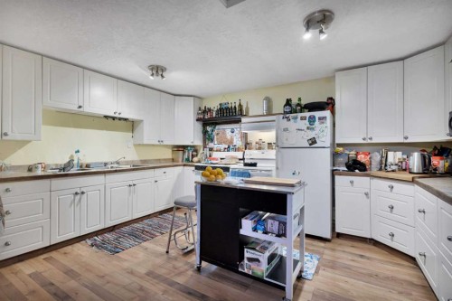 4824 50 Street, Clive, AB - Indoor Photo Showing Kitchen With Double Sink