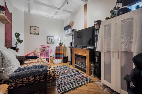 4824 50 Street, Clive, AB - Indoor With Fireplace