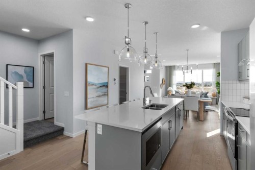 139 Huxland Road Ne, Calgary, AB - Indoor Photo Showing Kitchen With Double Sink With Upgraded Kitchen