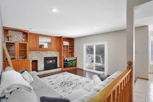 22 Denovan Crescent, Red Deer, AB - Indoor Photo Showing Living Room With Fireplace