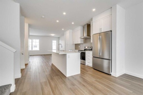 1123 Fowler Road Sw, Airdrie, AB - Indoor Photo Showing Kitchen With Upgraded Kitchen