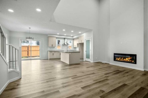 158 Osprey Hill Way Sw, Calgary, AB - Indoor Photo Showing Living Room With Fireplace