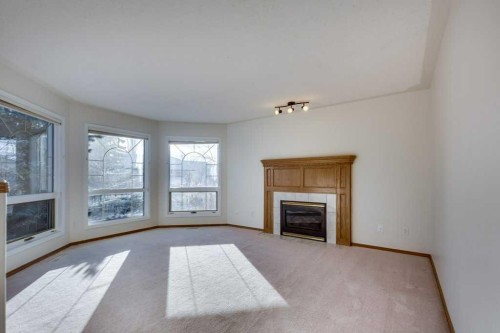 16 Lawrence Crescent, Red Deer, AB - Indoor Photo Showing Living Room With Fireplace