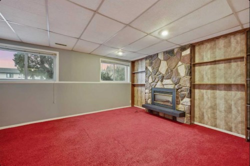 6121 Hamilton Drive, Red Deer, AB - Indoor Photo Showing Other Room With Fireplace
