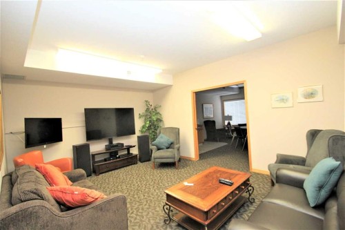 203-4512 52 Avenue, Red Deer, AB - Indoor Photo Showing Living Room