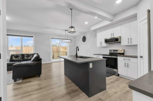 119 Crestview Boulevard, Sylvan Lake, AB - Indoor Photo Showing Kitchen With Stainless Steel Kitchen With Upgraded Kitchen