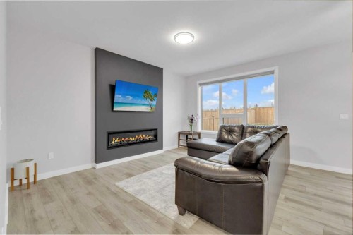 119 Crestview Boulevard, Sylvan Lake, AB - Indoor Photo Showing Living Room With Fireplace