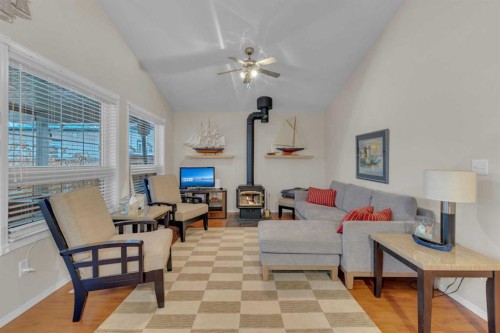 5003 36 Street, Sylvan Lake, AB - Indoor Photo Showing Other Room With Fireplace
