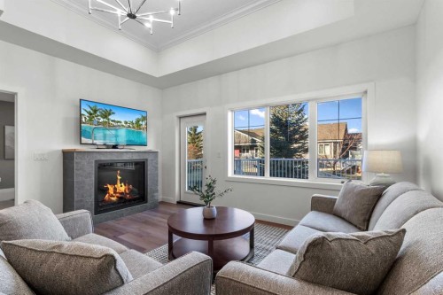 4930 Beardsley Avenue, Lacombe, AB - Indoor Photo Showing Living Room With Fireplace