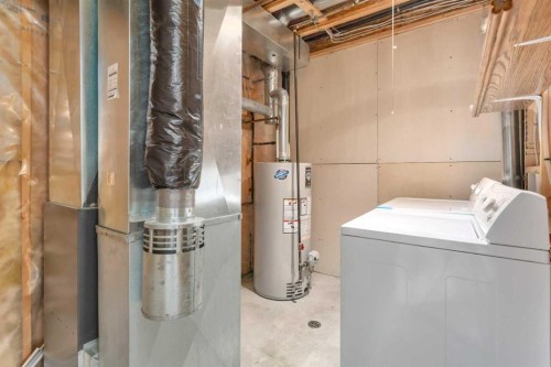 3 Lark Close, Sylvan Lake, AB - Indoor Photo Showing Laundry Room