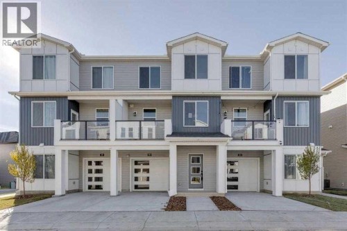 438-65 Belvedere Pointe Se, Calgary, AB - Outdoor With Balcony With Facade