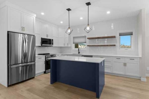 1-4413 48 Avenue, Sylvan Lake, AB - Indoor Photo Showing Kitchen With Upgraded Kitchen