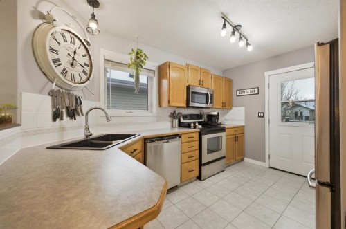 10 Halsall Street, Sylvan Lake, AB - Indoor Photo Showing Kitchen With Stainless Steel Kitchen With Double Sink
