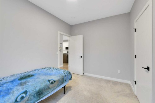 12 Hammond Close, Sylvan Lake, AB - Indoor Photo Showing Bedroom