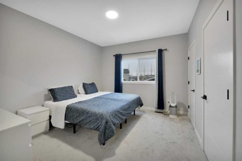12 Hammond Close, Sylvan Lake, AB - Indoor Photo Showing Bedroom