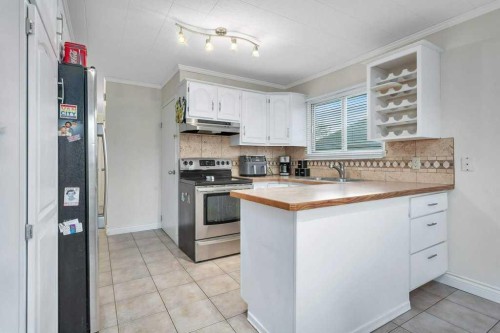 5702 West Park Crescent, Red Deer, AB - Indoor Photo Showing Kitchen With Double Sink