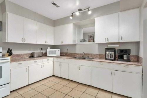 5702 West Park Crescent, Red Deer, AB - Indoor Photo Showing Kitchen With Double Sink