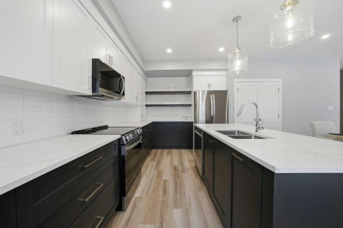 70 Palmer Circle, Blackfalds, AB - Indoor Photo Showing Kitchen With Double Sink With Upgraded Kitchen