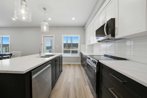 70 Palmer Circle, Blackfalds, AB - Indoor Photo Showing Kitchen With Double Sink With Upgraded Kitchen