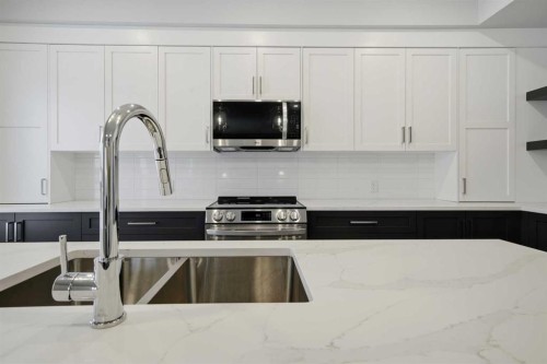 70 Palmer Circle, Blackfalds, AB - Indoor Photo Showing Kitchen With Double Sink