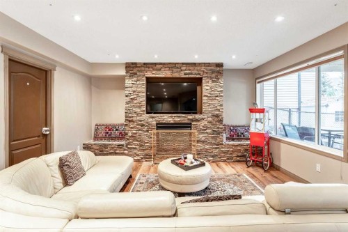 40 Cougar Ridge Heights Sw, Calgary, AB - Indoor Photo Showing Living Room With Fireplace