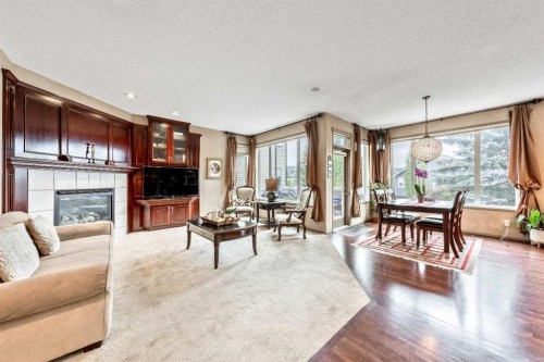 40 Cougar Ridge Heights Sw, Calgary, AB - Indoor Photo Showing Living Room With Fireplace