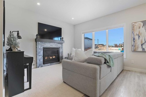 30 Palmer Circle, Blackfalds, AB - Indoor Photo Showing Living Room With Fireplace