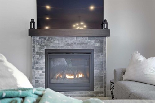 30 Palmer Circle, Blackfalds, AB - Indoor Photo Showing Living Room With Fireplace