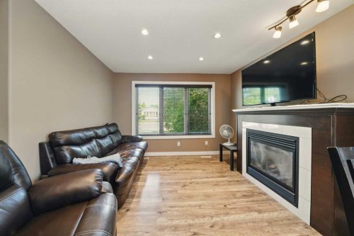 3717 45 Street, Red Deer, AB - Indoor Photo Showing Living Room With Fireplace