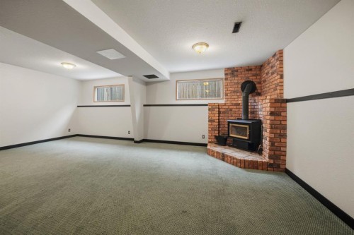 56 Marion Crescent, Red Deer, AB - Indoor With Fireplace