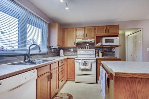 57 Mcdougall Crescent, Red Deer, AB - Indoor Photo Showing Kitchen With Double Sink