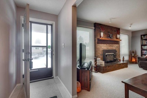 57 Mcdougall Crescent, Red Deer, AB - Indoor Photo Showing Living Room With Fireplace