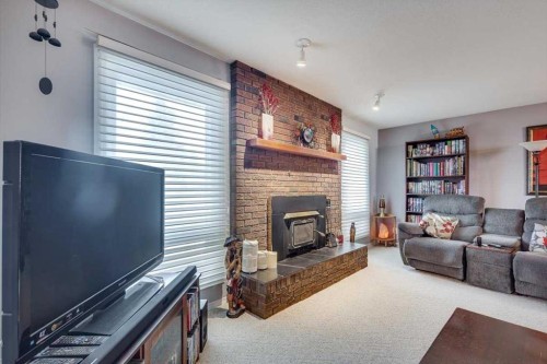 57 Mcdougall Crescent, Red Deer, AB - Indoor Photo Showing Living Room With Fireplace