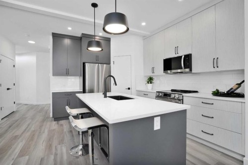 18 Palmer Circle, Blackfalds, AB - Indoor Photo Showing Kitchen With Upgraded Kitchen