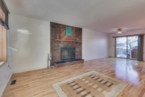 8 Nielsen Close, Red Deer, AB - Indoor Photo Showing Living Room With Fireplace