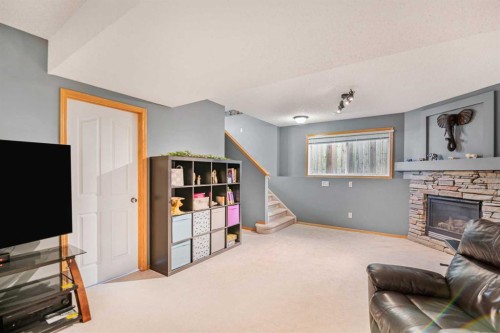 27 Jacobs Close, Red Deer, AB - Indoor Photo Showing Other Room With Fireplace