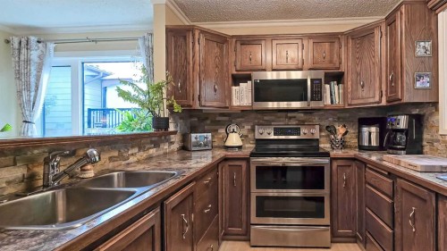 58 Maxwell Avenue, Red Deer, AB - Indoor Photo Showing Kitchen With Double Sink