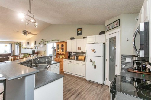 34 Iron Wolf Ridge, Lacombe, AB - Indoor Photo Showing Kitchen With Double Sink