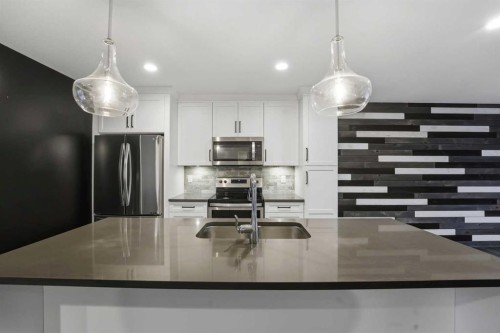 4140 Ryders Ridge Boulevard, Sylvan Lake, AB - Indoor Photo Showing Kitchen With Stainless Steel Kitchen With Upgraded Kitchen