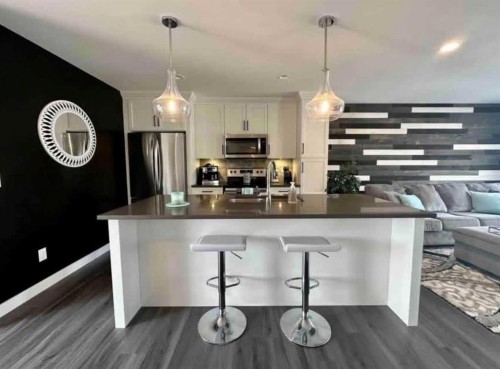 4140 Ryders Ridge Boulevard, Sylvan Lake, AB - Indoor Photo Showing Kitchen With Stainless Steel Kitchen With Upgraded Kitchen