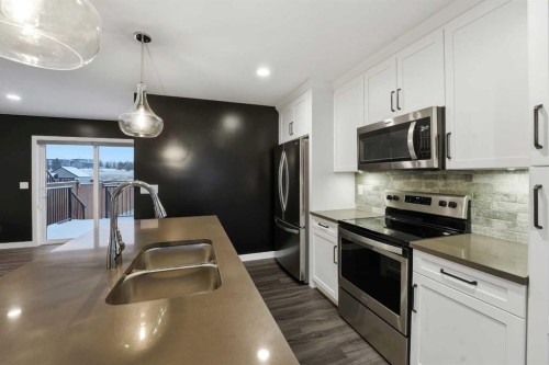 4140 Ryders Ridge Boulevard, Sylvan Lake, AB - Indoor Photo Showing Kitchen With Stainless Steel Kitchen With Double Sink With Upgraded Kitchen