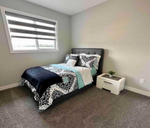 4140 Ryders Ridge Boulevard, Sylvan Lake, AB - Indoor Photo Showing Bedroom
