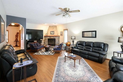 10-27501 Township Road 374, Rural Red Deer County, AB - Indoor Photo Showing Living Room With Fireplace