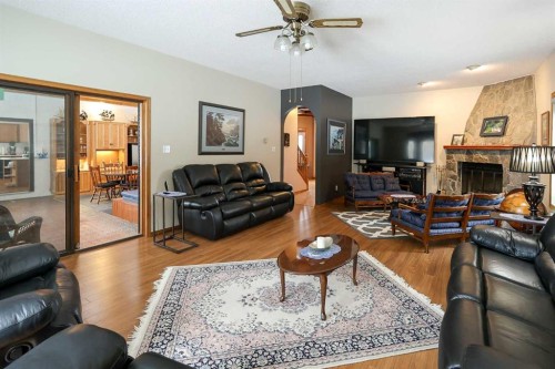 10-27501 Township Road 374, Rural Red Deer County, AB - Indoor Photo Showing Living Room With Fireplace