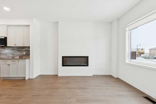 3586 Chestermere Boulevard, Chestermere, AB - Indoor Photo Showing Living Room With Fireplace